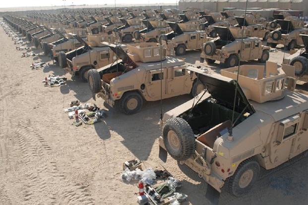 High-mobility multipurpose wheeled vehicles prepared and stored by the 2d Battalion, 401st Army Field Support Brigade, stand ready at Camp Arifjan, Kuwait. (U.S. Army/Galen Putnam)