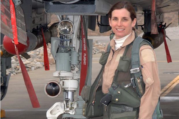 Lt. Col. Martha McSally stands with her A-10 Thunderbolt, Dec. 6, 2006. McSally was the first female pilot in the Air Force to fly in combat and to serve as a squadron commander of a combat aviation squadron. (U.S. Air Force photo)