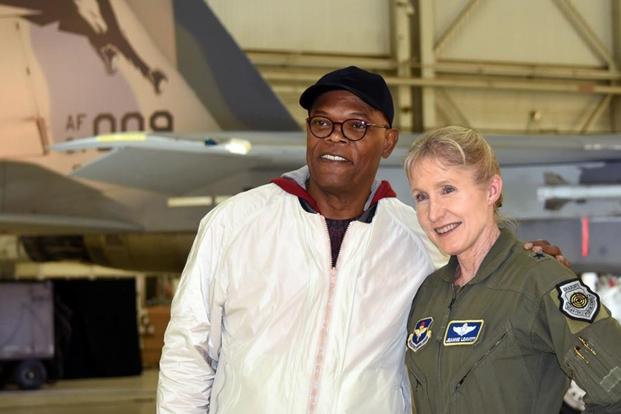 Actor Samuel L. Jackson poses with Gen. Jeannie Leavitt after receiving a challenge coin from her during a media event for "Captain Marvel" at Edwards Air Force Base, Calif., Feb. 20, 2019. (DoD photo by Shannon Collins)