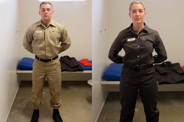 Yeoman 2nd Class John LeBaron, corrections specialist, Naval Consolidated Brig Chesapeake, models the new post-trial standardized prisoner uniform (left), while Master-at-Arms 2nd Class Neah Rau, corrections specialist, Naval Consolidated Brig Chesapeake models the new pre-trial standardized prisoner uniform. (U.S. Navy photos) 