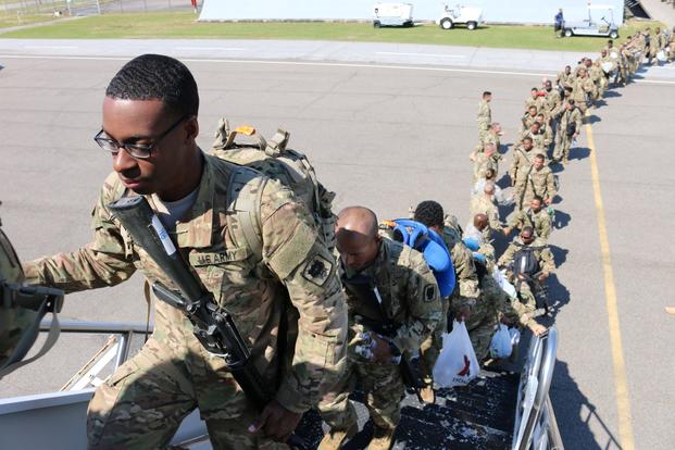 Soldiers of the 518th Tactical Installation and Networking Company, 67th Signal Battalion (Expeditionary), 35th Signal Brigade (Theater Tactical), board a plan at Augusta Regional Airport, Augusta, Georgia, as they prepare to depart for a 9-month deployment in support of U.S. Central Command in Southwest Asia May 9, 2016. (Lindsay D. Roman/U.S. Army)