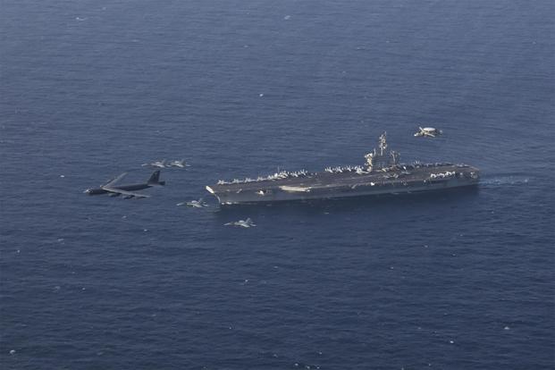 Abraham Lincoln Carrier Strike Group and a U.S. Air Force B-52H Stratofortress conduct joint exercises in the U.S. Central Command area of responsibility. (U.S. Navy/Mass Communication Specialist 3rd Class Amber Smalley)