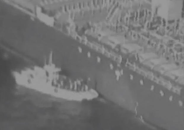 Video released by U.S. Central Command shows a Islamic Revolutionary Guard Corps patrol boat removing a mine from the side of a tanker attacked near the Strait of Hormuz June 13. (Screenshot via CENTCOM)