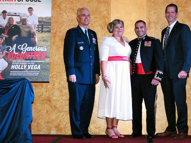 Vice Chairman of the Joint Chiefs of Staff Air Force Gen. Paul J. Selva, Holly Vega, Marine Corps Lt. Col. Javier Vega, and retired Air Force Lt. Gen. Stanley Clarke III, chairman of the Armed Forces Insurance board of directors, participate in the 2019 Armed Forces Insurance Military Spouse of the Year award ceremony at Joint Base Myer-Henderson Hall, Va., May 9, 2019.  (DoD/Todd C. Lopez)