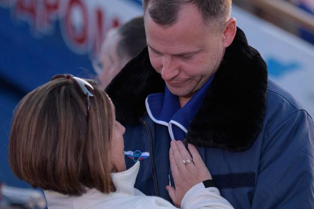 Air Force Col. Catie Hague and Air Force Col. Nick Hague are reunited after Nick Hague’s launch to space was aborted on Oct. 11, 2018. NASA photo