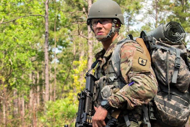 A U.S. Army National Guard officer candidate stands ready with his M249 SAW machine gun during a squad movement exercise during officer candidate school May 4, 2019, at McCrady Training Center, Eastover, South Carolina. (U.S. Army National Guard photo/Jerry Boffen)