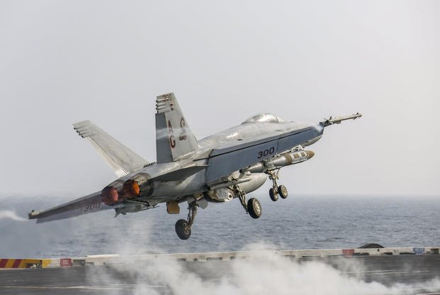 An F/A-18E Super Hornet attached to the Sidewinders of Strike Fighter Squadron (VFA) 86 launches from the flight deck of the aircraft carrier USS Abraham Lincoln in the Arabian Sea (Michael Singley/U.S. Navy)