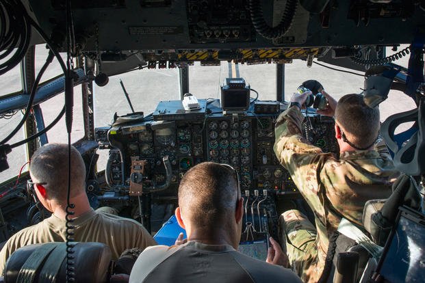 Col. Stephen Gwinn, 103rd Airlift Wing commander, Master Sgt. Justin Taylor, 118th Airlift Squadron flight engineer, and Lt. Col. Neal Byrne, 103rd Maintenance Squadron commander, complete preflight checklists in the cockpit of a C-130H Hercules assigned to the 103rd Airlift Wing, Bradley Air National Guard Base, East Granby, Conn. Aug. 8, 2019. (U.S. Air National Guard photo/Steven Tucker)