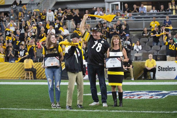 Korean War veteran Ed Portka and his stepson, former Maj. David Reser, stand on the football field in Pittsburgh Sept. 30, 2019, to be recognized following the third quarter of a game the Pittsburgh Steelers won 27-3 against the Cincinnati Bengals. (Photo courtesy of the Pittsburgh Steelers)