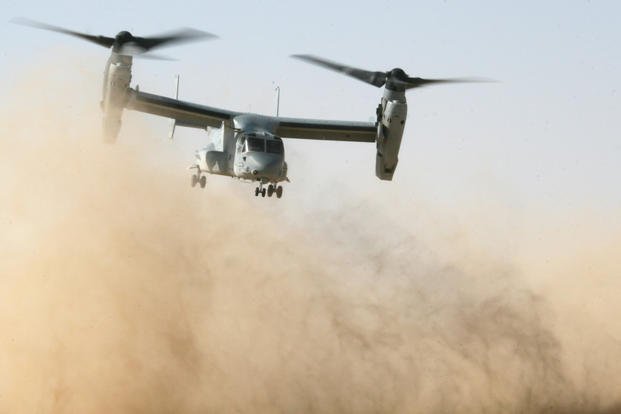 An MV-22B Osprey from Marine Medium Tiltrotor Squadron 263 (Reinforced), 22nd Marine Expeditionary Unit, kicks up a cloud of sand and dirt as it takes off for a simulated medical evacuation mission during a Helicopter Assault Course training evolution near Camp Buehring, Kuwait, Sept. 3, 2009. (U.S. Marine Corps photo/Theodore Ritchie)