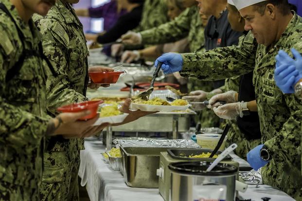 Sailors and students from the Naval Diving and Salvage Training Center feast on turkey and all the trimmings during a Thanksgiving dinner at Naval Support Activity Panama City, Fla., Nov.14, 2019. (U.S. Navy)