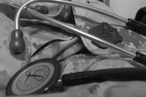 This collage includes a stethoscope, camouflage utilities and a caduceus insignia. (U.S. Marine Corps)