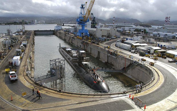 The Los Angeles-class attack submarine USS Buffalo (SSN 715) undocks from Dry Dock 2 at Pearl Harbor Naval Shipyard