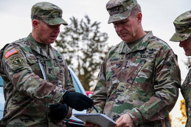 Sergeant Major Curtis Cox briefs Gen. James C. McConville