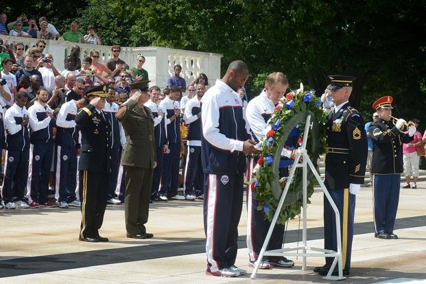Kobe Bryant lays a wreath at Arlington National Cemetery