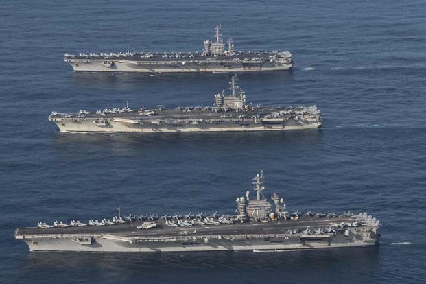 The carriers USS Ronald Reagan, USS Theodore Roosevelt and USS Nimitz.