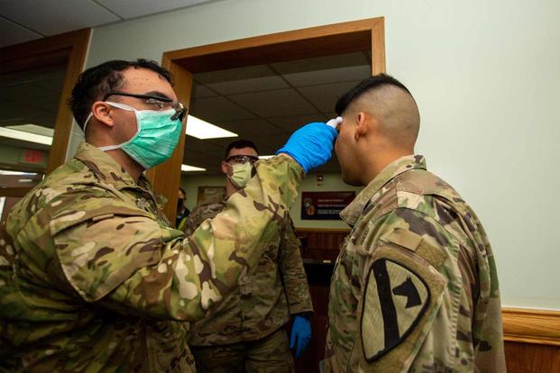 Soldiers stationed on U.S. Army Garrison Casey conduct pre-screening.