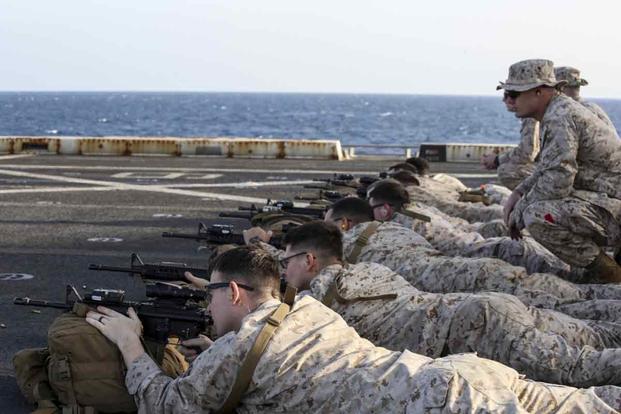 Marines fire M4 carbine and M16A4 rifles during  live-fire aboard the USS New York.