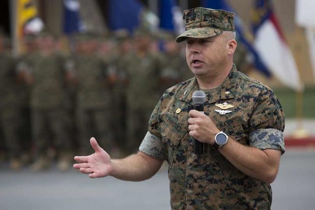 Capt. Michael O. Enriquez speaks to friends and family during a ceremony at Camp Pendleton.