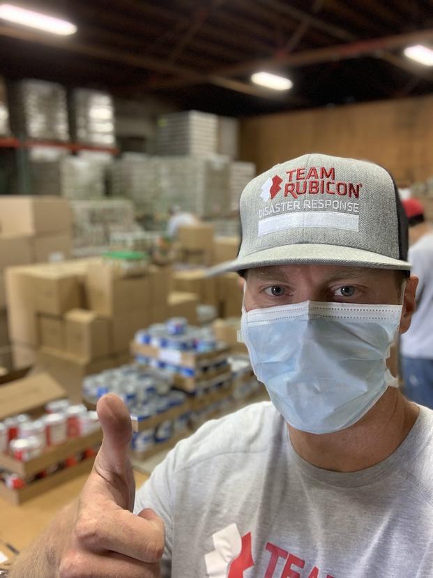 member of team rubicon wearing a mask