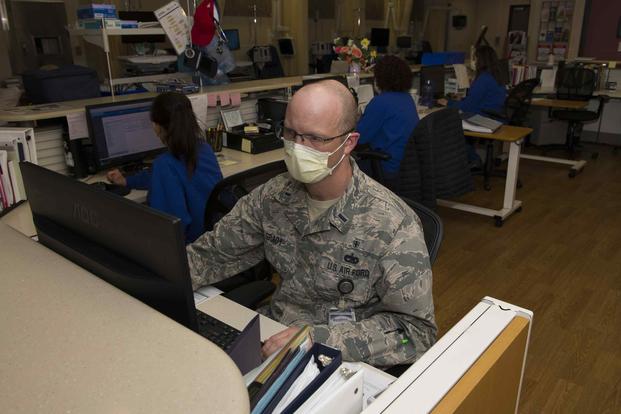 Airman reviews a patient's records at David Grant USAF Medical Center at Travis Air Force Base, California.