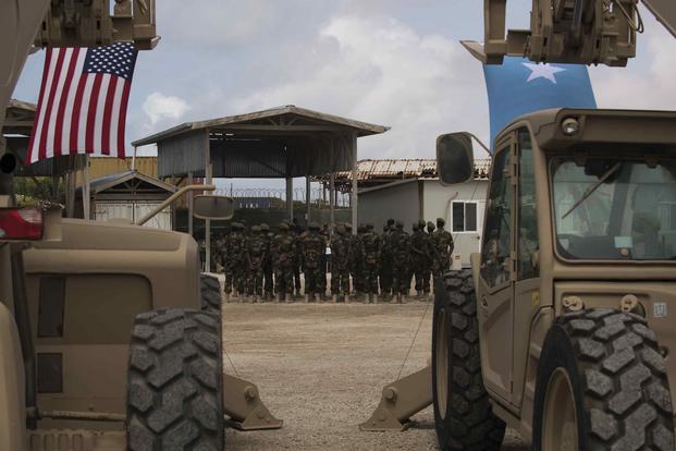 Somali national army soldiers stand in formation during a logistics course graduation ceremony.