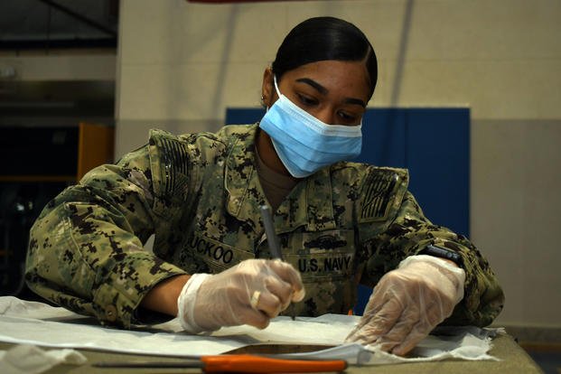 Navy Reservist cuts face mask