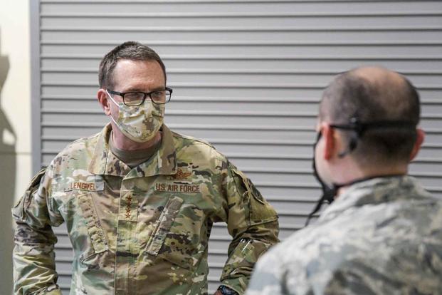 General Joseph L. Lengyel (left), Chief of the National Guard Bureau, visits Texas National Guard service members serving at the Tarrant Area Food Bank in Fort Worth.