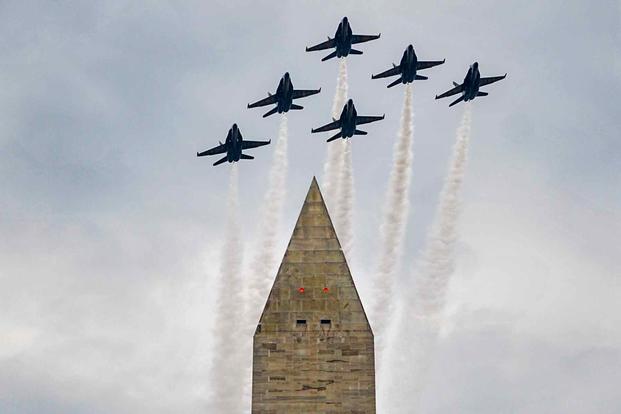 The Blue Angels fly over the Washington Monument during a Fourth of July celebration.