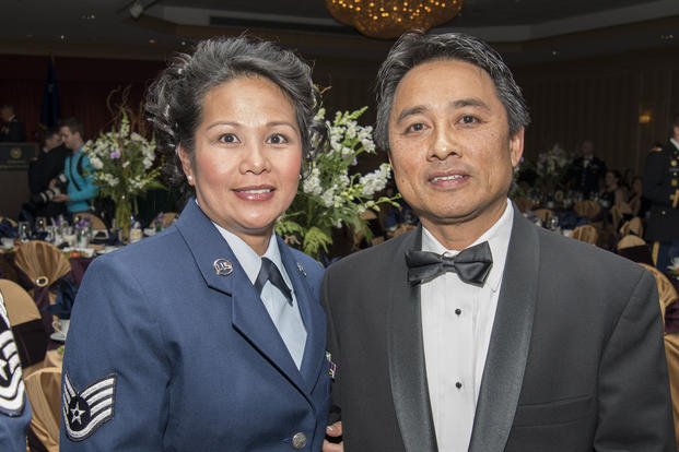 female air force service member with male spouse in tux