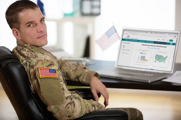 soldier sitting at computer