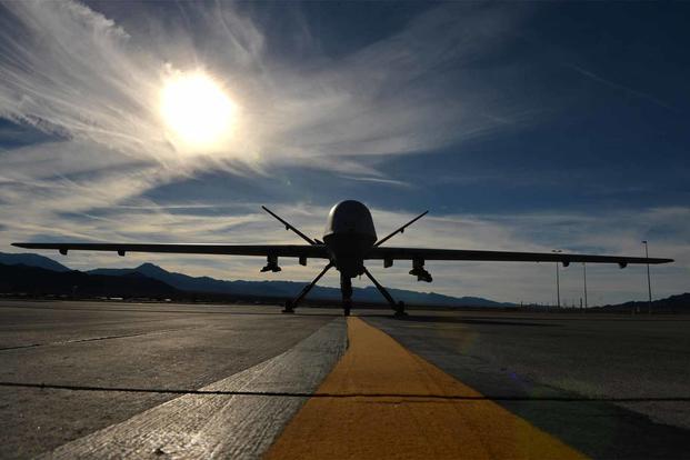 An MQ-9 Reaper remotely piloted aircraft awaits maintenance.