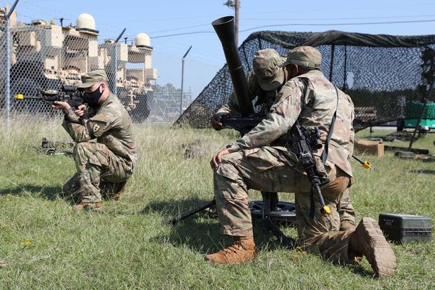 Mortarmen practice crew drills during an exercise at Fort Polk.