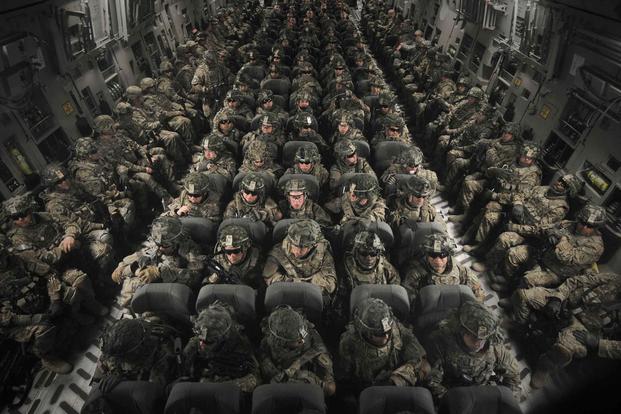 Soldiers deploy to Afghanistan aboard a C-17 