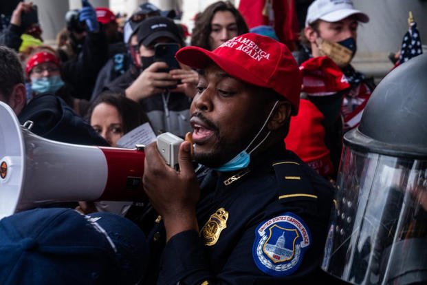 Capitol police in MAGA hat