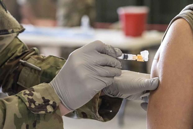 Airman receives the Covid-19 vaccine.