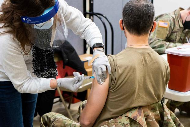 A U.S. Army soldier receives his first dose of the Moderna COVID-19 Vaccine.
