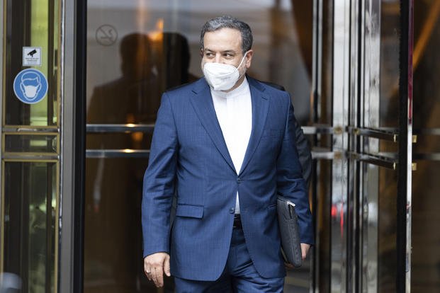 Political deputy at the Ministry of Foreign Affairs of Iran Abbas Araghchi leaves a hotel in Vienna.