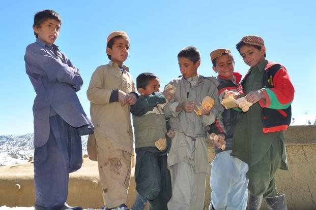 Afghan kids receive toys.