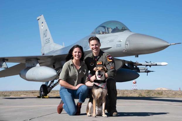 David Schmitz with Valerie and their dog on the flight line at Holloman.