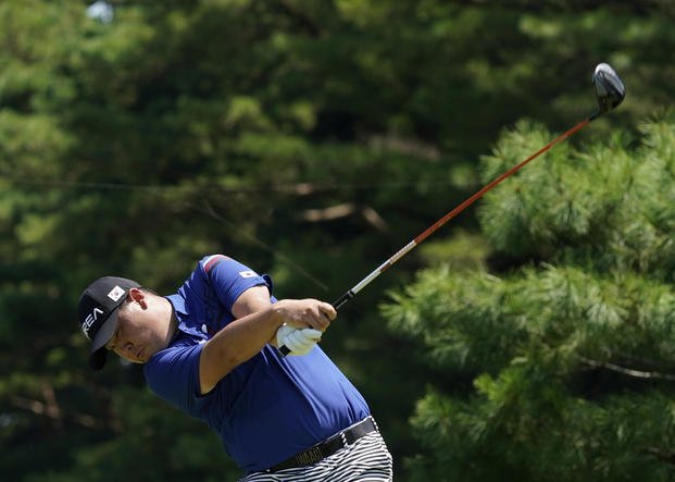 Korea's Si Woo Kim practices at the 2020 Summer Olympics