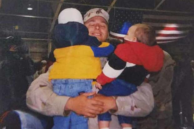 Tom Smoot hugs his kids