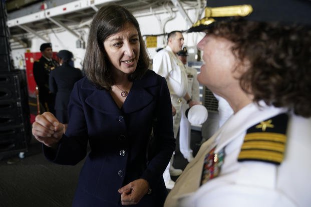 Rep. Elaine Luria speaks to a Naval officer aboard the USS Kearsarge at Naval Station Norfolk.