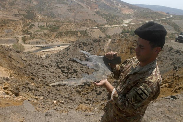 Lebanese army soldier displays part of an Israeli missile