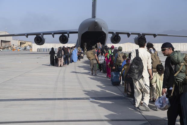 Evacuees flee from Afghanistan on U.S. Air Force plane.