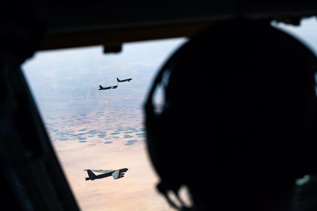 A U.S. Air Force B-52 Stratofortress is aerial refueled by a U.S. Air Force KC-135 Stratotanker.