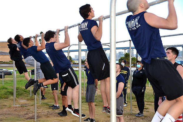 Completing pull-ups during Navy physical screening test