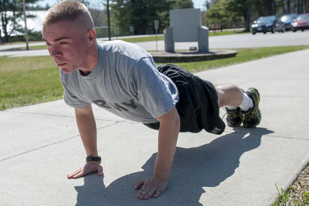 Soldier performs push-ups during Army physical fitness test.