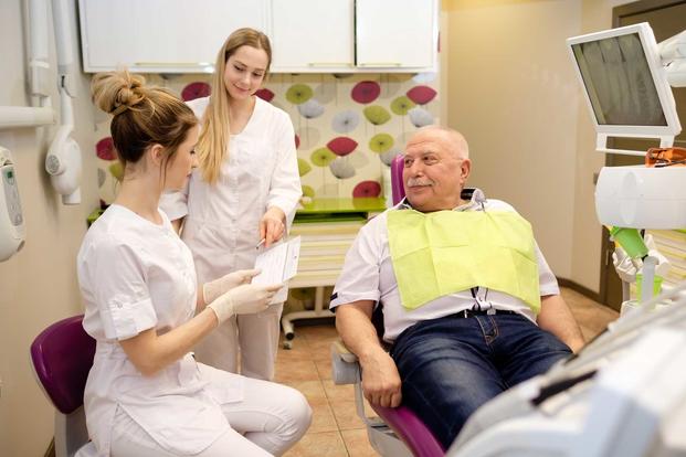 Older man sitting in dentist chair