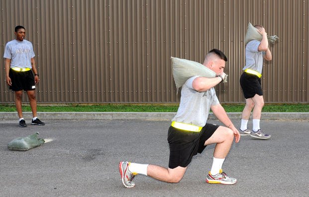 Performing a forward lunge with added weight